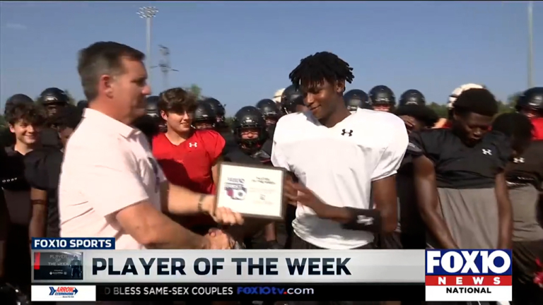 David Greene presenting Aaden Shamburger Player of the Week