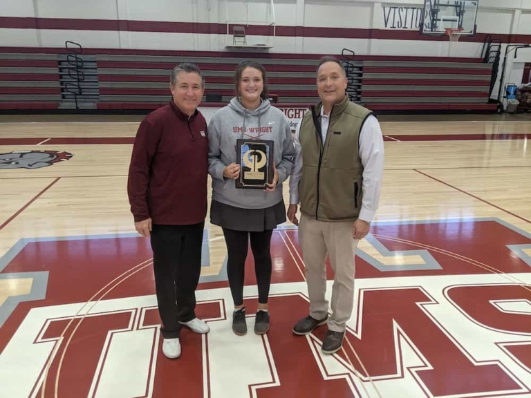 Coach Terry Canova and Will Phillips presents Greene & Phillips Player of the Week to Ansleigh Ishee