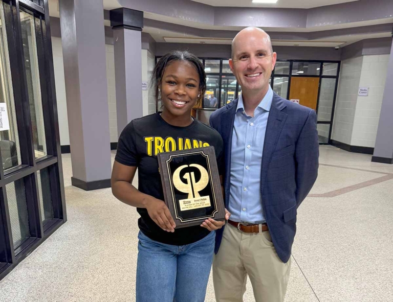 Stephen Collins presents Player of the Week Award to Wrestler, Kalyse Hill